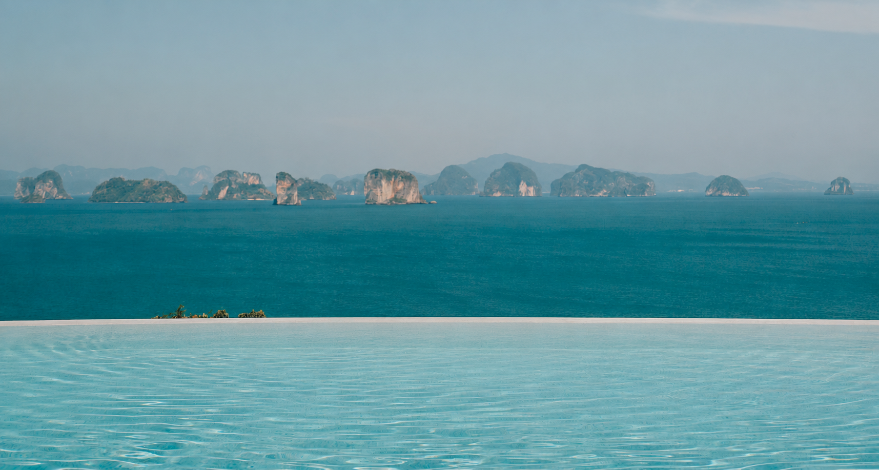 Infinity pool overlooking the ocean at sunset